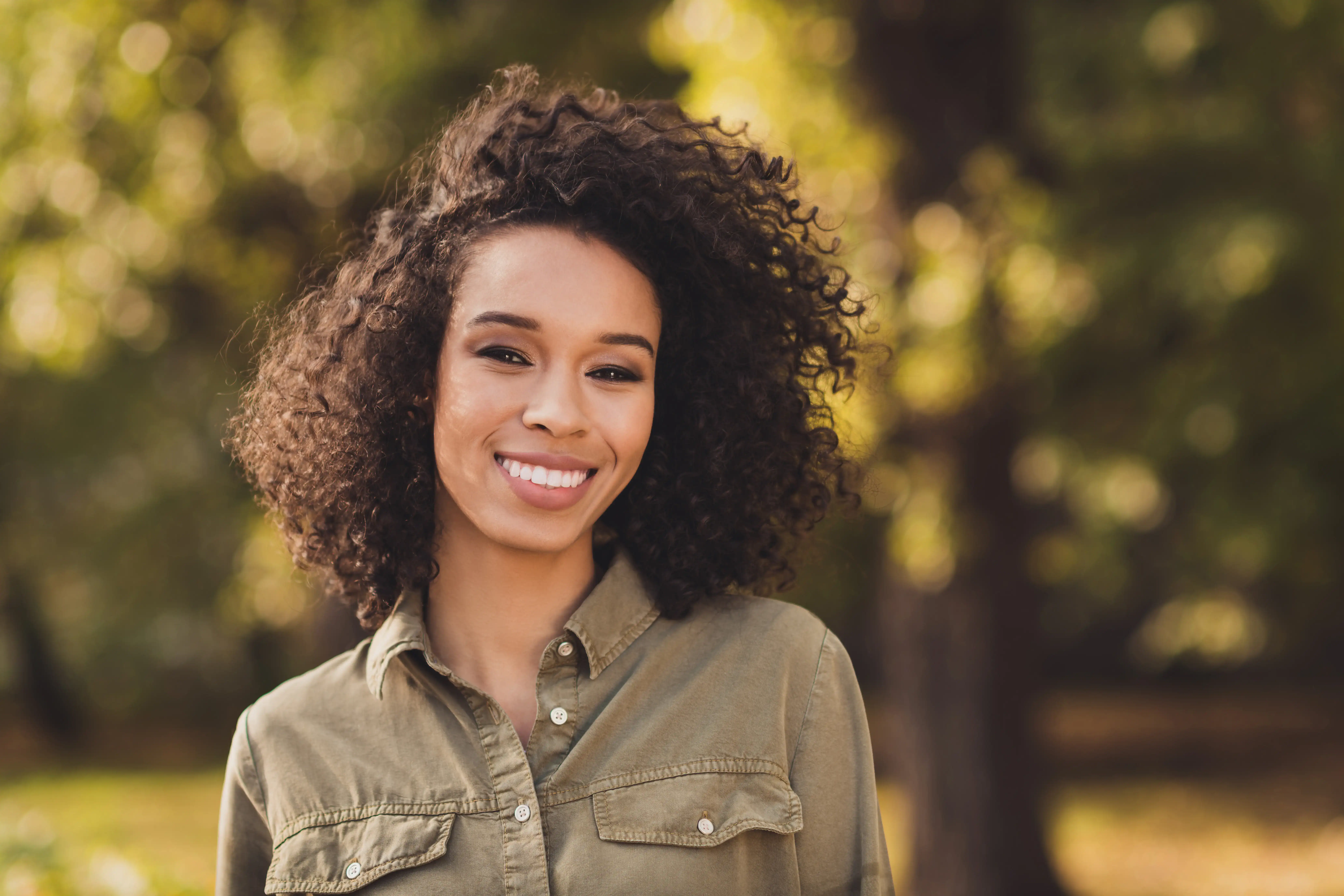 Smiling Black woman with great skin on a fall day