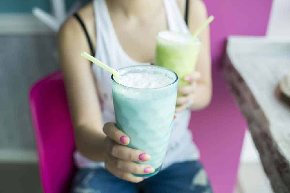 Teenage girl with a milkshake