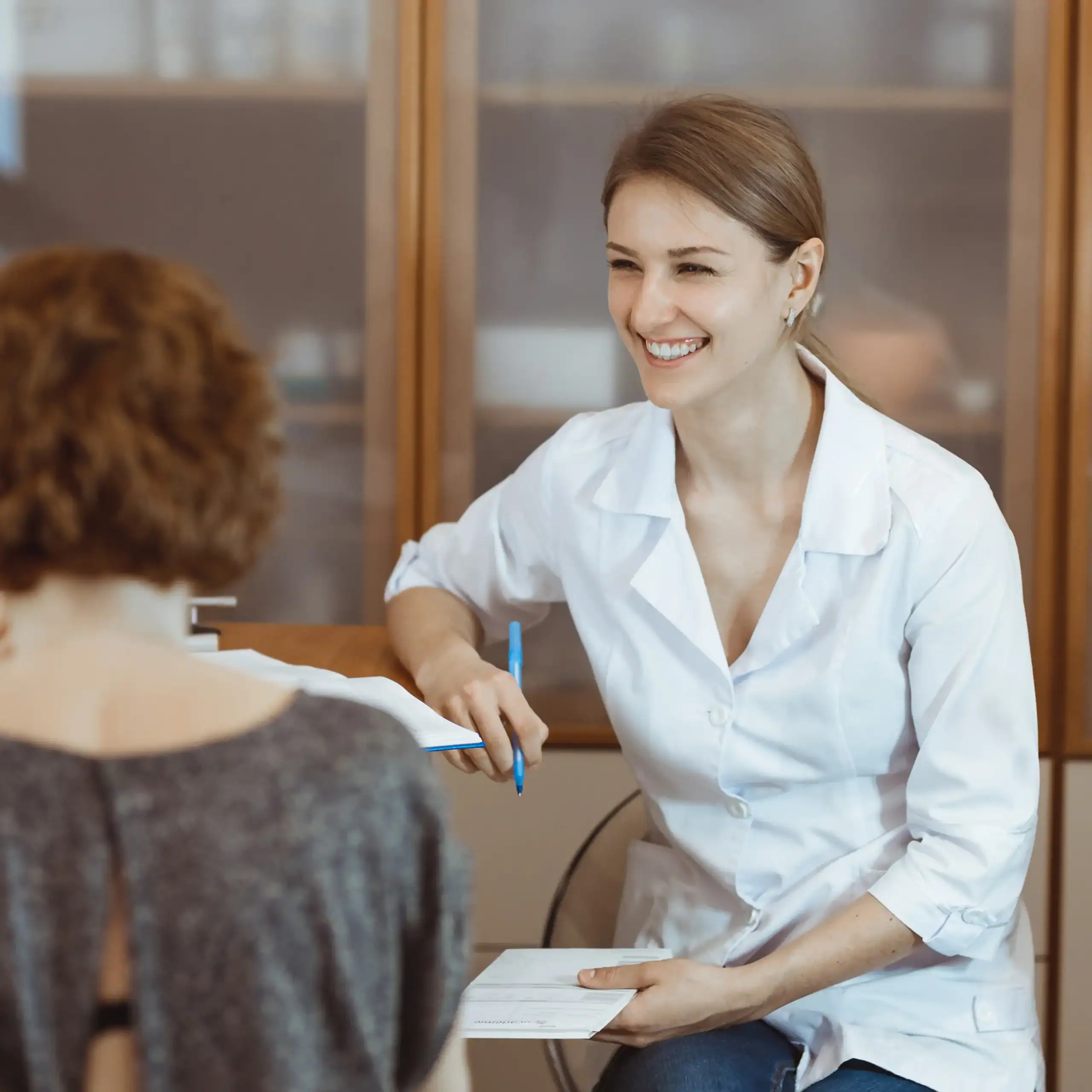 Physician consults with a patient